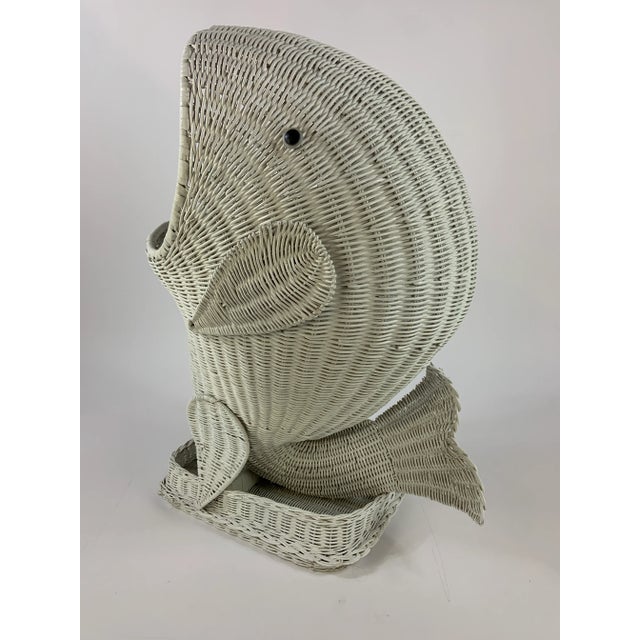 Wonderful unique white painted wicker floor basket shaped like a whale. It is the perfect accent piece for a pool house to...
