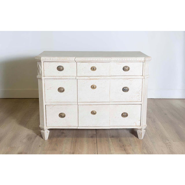 This Swedish chest of drawers is a fine example of Scandinavian craftsmanship and design. Constructed from pine, a wood...