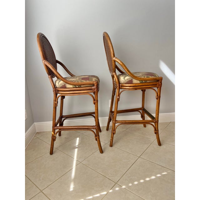 Mid Century bamboo & Rattan back stools . There is a Brass plate on foot rest. Coastal Tropical Palm tree upholstery...