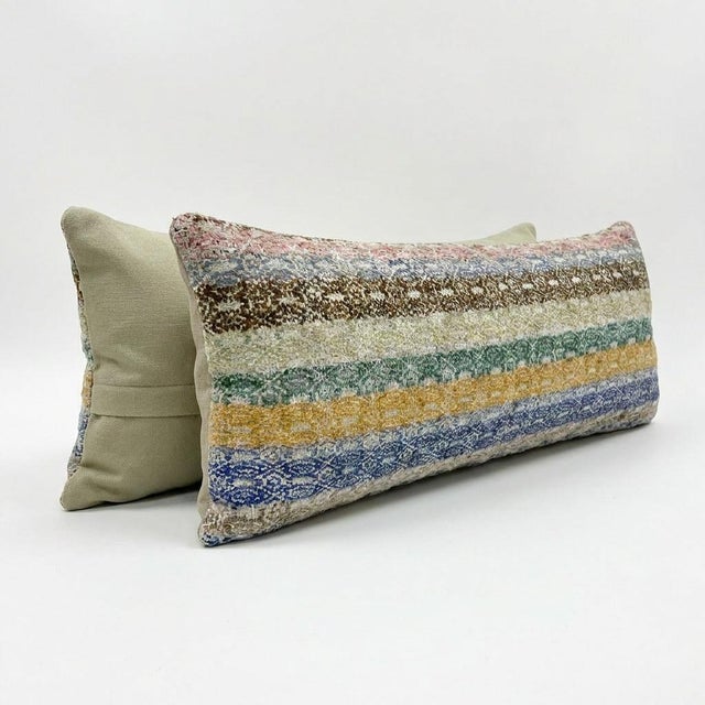 This beautiful 17'' x 50'' hand-woven Kilim pillow cover was made from an authentic Turkish kilim. The traditional flat-...