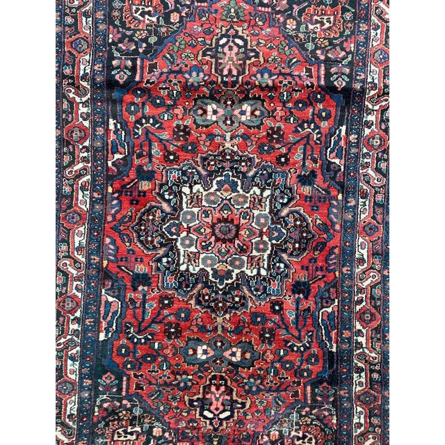 Beautiful mid 20th century Kurdish rug with a nice floral design with a central medallion and beautiful colours with a red...