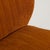 This set of 3 lounge chairs carries genuine presence, its burnt orange/rust upholstery, tapered wood legs immediately...