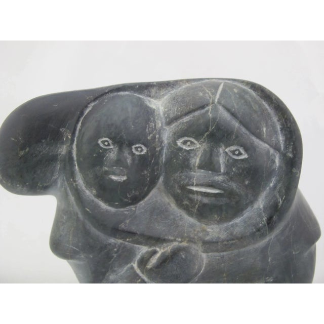 Inuit Stone Carving Mother & Child by Mathew Aqigaaq (1940-2010), Baker Lake. Measures 8" tall x 7" x 5". Stone is either...