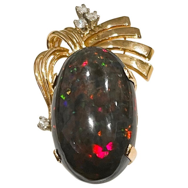Approximately 30 Carat Oval Ethiopian Black Opal Pendant 18 Karat This spectacular Pendant Necklace consisting of a single...