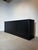 This extra-long black sideboard combines clean modern lines with a timeless, architectural presence. Finished in a deep...
