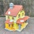Vintage Lemax porcelain lighted house for display. Yellow house with red tiled roof and gray chimney, light with switch...