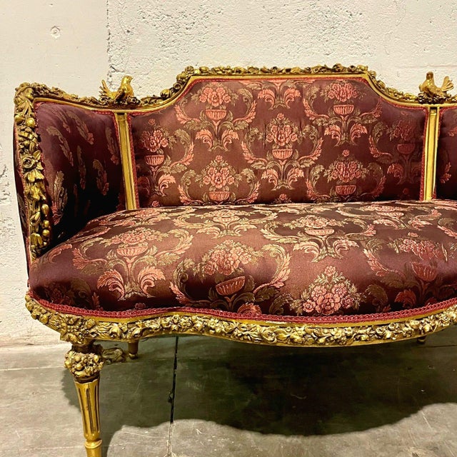Fall in love with the timeless elegance of this French Baroque sofa, featuring a hand-carved frame with intricate...