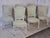 Set of six antique french dining chairs in louis xvi style. The chairs feature a beautiful, worn off-white/cream patina...