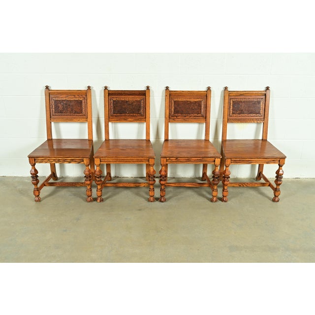 An exceptional set of four antique English Jacobean style dining chairs By Batesville Cabinet Co. (early Romweber) USA,...