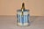 Mid- 20th century confections tin made in England. It is decorated with a Romanesque pattern in bold blue and white. The...