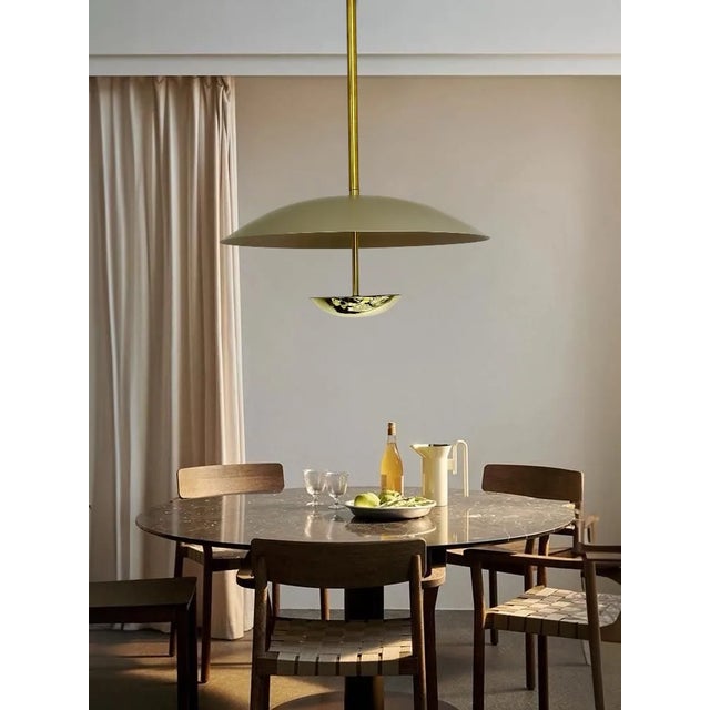 Illuminate your space with this exquisite handmade modern brass and metal chandelier. Crafted with precision and care,...