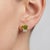 Infuse your jewelry collection with vibrant, sun-drenched color. These striking geometric stud earrings feature a...