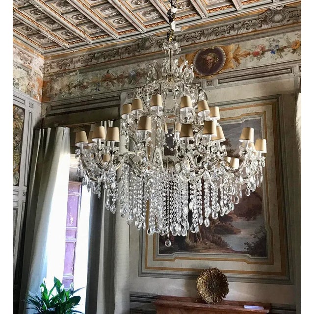 - Monumental 36-light crystal chandelier - Creamy colored silk shades, as seen in photos - Requires E14 Light bulbs for...