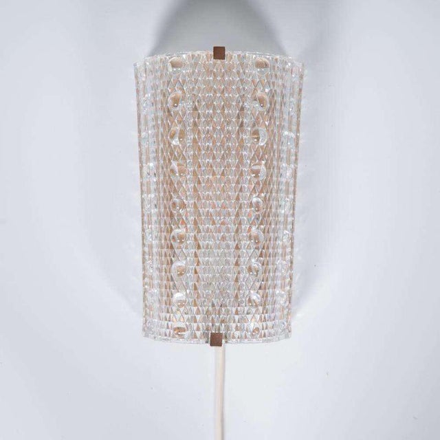 Beautiful wall lamp from the sixties designed in the style of Carl Fagerlund and made by the Danish Lyfa (marked). The...