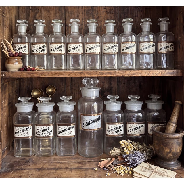 A collection of sixteen early 20th-century apothecary jars by Whitall Tatum Company of Millville, New Jersey, one of...
