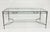 An elegant and highly collectible vintage wrought iron patio dining table designed by Mario Papperzini for Salterini,...