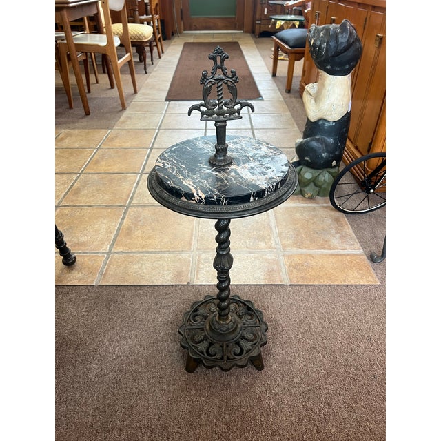 Rembrandt brass and cast-iron marble top, smoking stand or side table, drink stand In exceptional condition