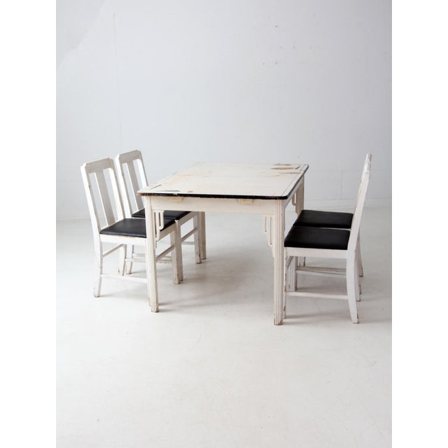 1930s–1940s Square Brand dining set by Crittenden & Eastman Co featuring a painted white table with a black-edged top and...