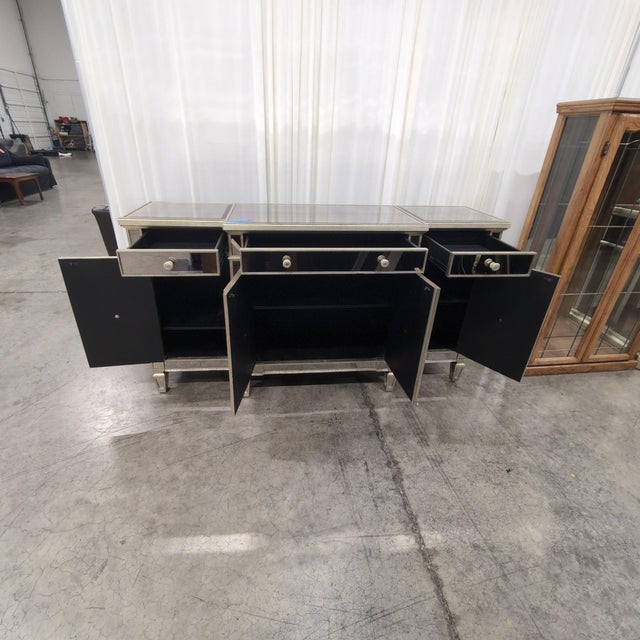 Horchow Amelie mirrored breakfront buffet in the glamorous Hollywood Regency style, with antiqued smoked mirror panels on...
