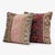 This 20'' x 20'' pillow cover set was made from authentic Turkish rug pieces — faded pink medallion stripe beside plum...