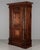 Made of solid walnut and veneers of walnut with pine as a secondary wood. The door has marquetry inlaid architectural...