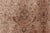 An early 20th century Persian Tabriz rug, the abrashed pale rust field with an allover trellis design of medallions, leafy...
