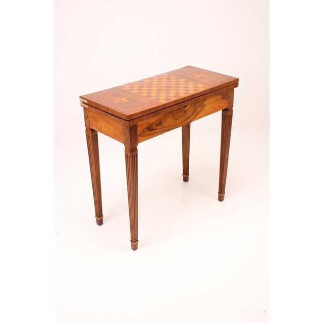 Refined early 19 th - century game table , designed for chess and card games , exemplifying the understated elegance and...