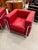 Stylish pair of chrome and red leather club chair in the style of Le Corbusier.