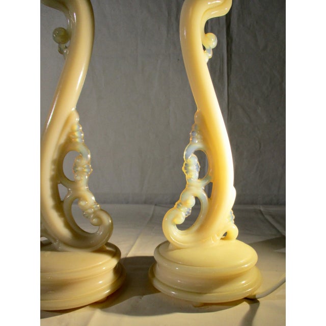 Alacite glass by Aladdin was created in 1938. These are patent-pending models. Opalescence in a creamy blush tone. An...