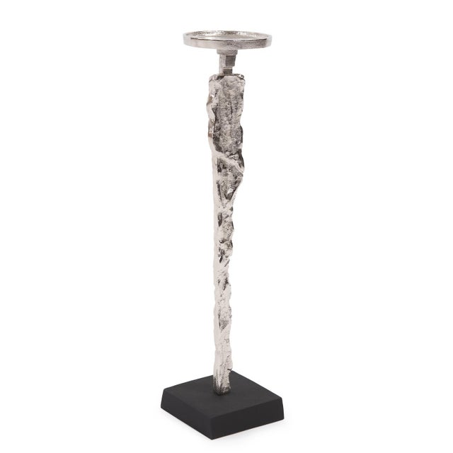 Hand sketches of human silhouettes on a napkin were transformed into a cast aluminum base for this candle holder. Finished...