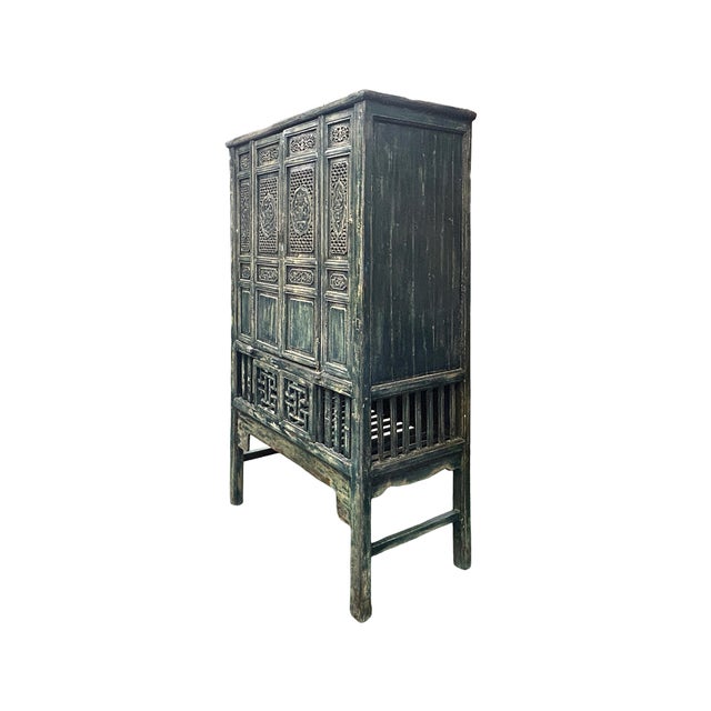 Elevate your living space with this exquisite vintage Chinese cabinet, a masterclass in craftsmanship that bridges the gap...