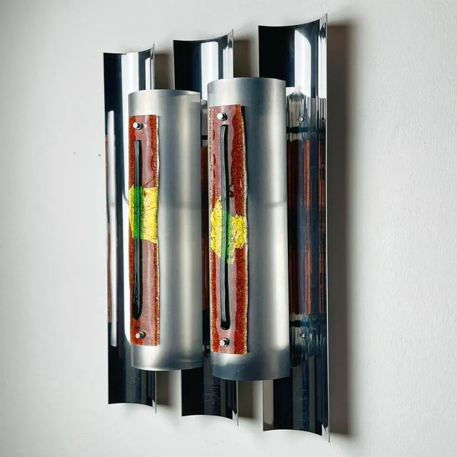 Introduce a statement piece to your interior with the imposing wall lamp designed by Angelo Brotto for Esperia in Italy...