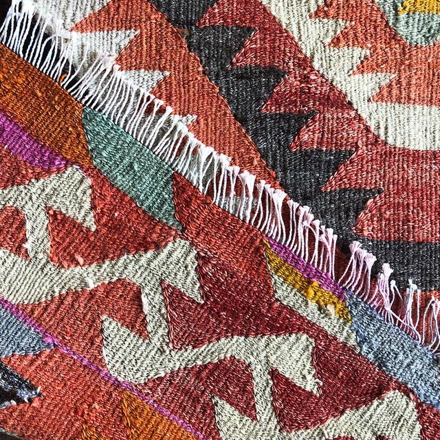 Beautiful geometric Kilim rug from Turkey. Great for by a bed, in a nursery, front door or foyer. Colors in pink, yellow,...