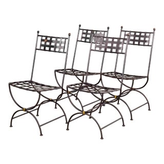 Set of Four French Iron Curule Side Chairs With Woven Strap Seats For Sale