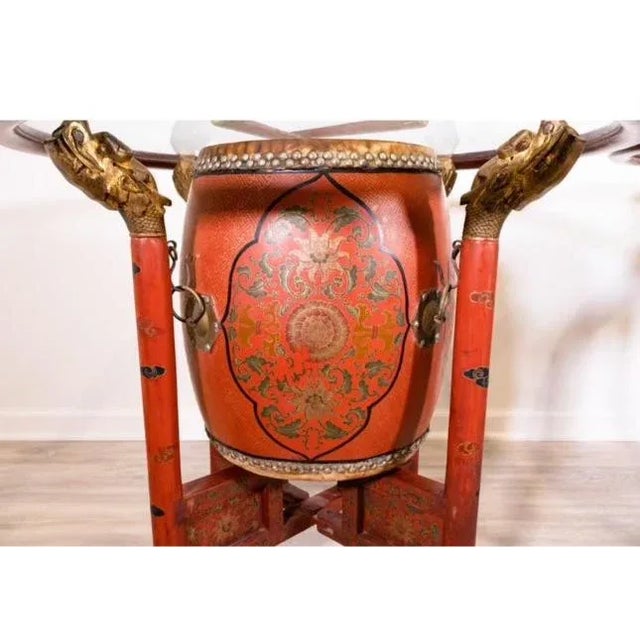 Unique Pair of Early 20th Century Antique Chinese Polychrome Gilt Decorated Red Drum Glass Top Tables A stunning pair of...