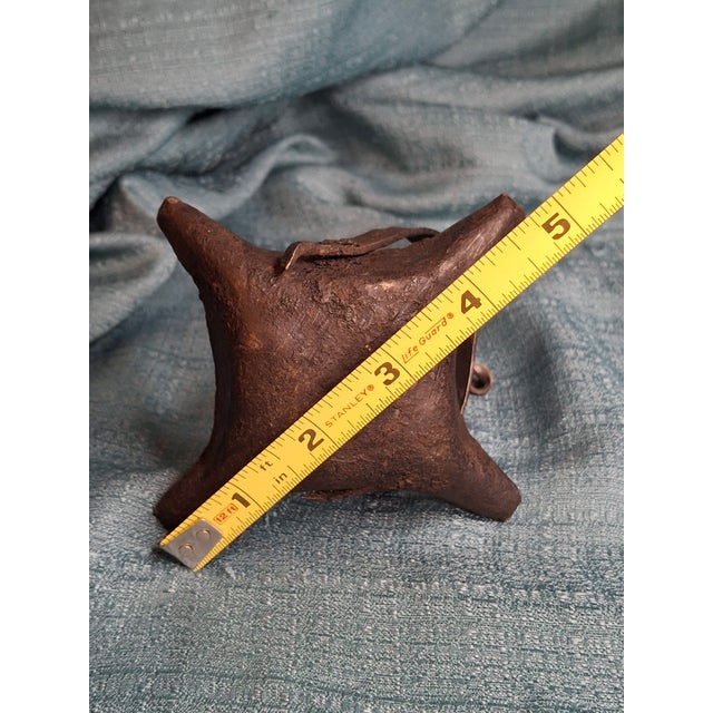 Offering a exceptional 18th-century hand-forged wrought iron fat lamp of rare form. Unlike the typical single-spout crusie...