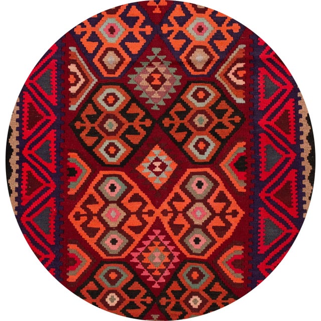 A beautiful hand-woven vintage Kilim runner with a red field, and multi-color accents an all-over geometric design. This...