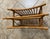Vintage rattan magazine rack with a double-compartment design. This piece is constructed from natural honey-toned rattan...