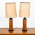 Compact mid century American round solid walnut lamp set with unique cane shades. Both are fully functional and are in...