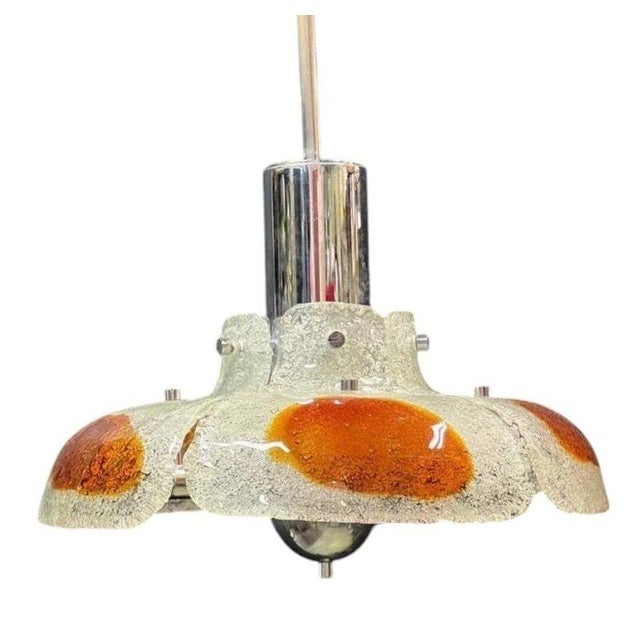 A striking 1970s Italian pendant light by Mazzega, crafted from hand-worked Murano glass and distinguished by its...