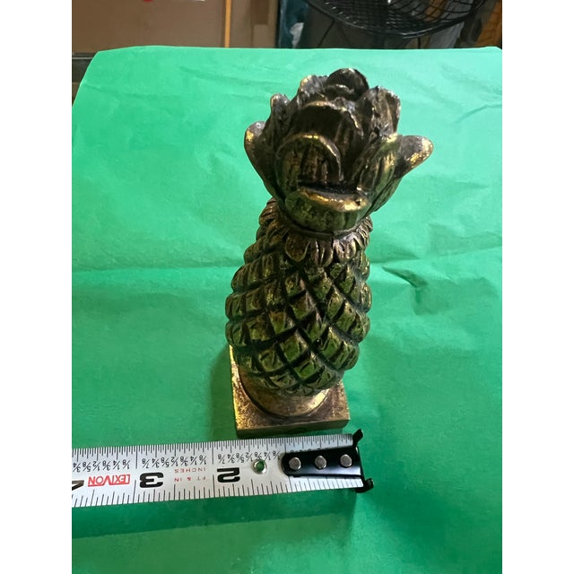 Up for consideration is a beautiful vintage small light weight gold pineapple. This would look lovely in your home and it...