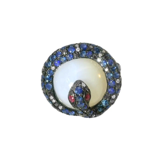 14K white gold designer ring featuring a large polished chalcedony quartz center stone (~14mm), accented with natural...