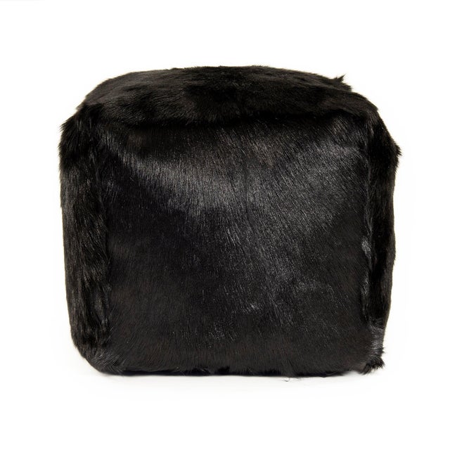 The 22" x 22" Tibetan Black Goat Fur Pouf from Zentique is a luxurious floor pouf covered in plush black Tibetan goat fur....
