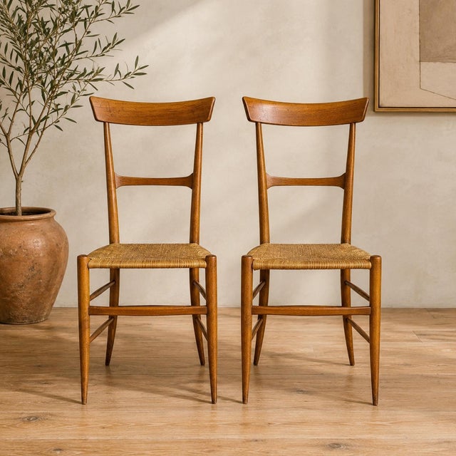 A beautifully sculptural pair of vintage Italian Chiavari chairs attributed to Fratelli Podestà, Italy, circa 1950s. These...