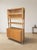 Elegant mid-century wall shelf bookcase designed by František Jirák for Tatra nábytok during the 1960s. The piece combines...