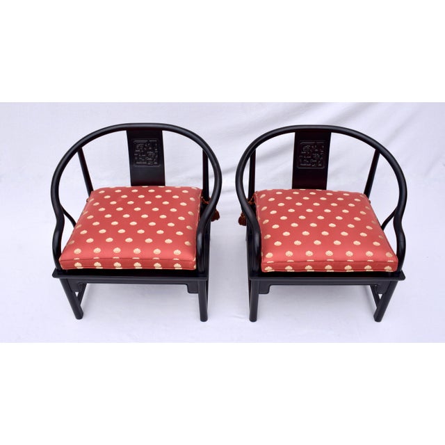 An impressive pair of solid Ebony mid 20th Century Chinoiserie accent chairs with distinct influences seen in later...