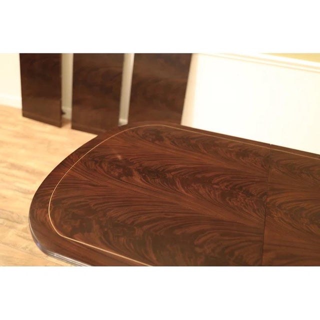 Originally $10,500 plus shipping. Like new. Duncan Phyfe classic style double pedestal starts out at 75 inches and expands...