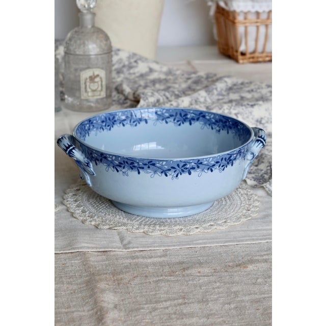 Elegant antique blue earthenware vegetable dish from the Mimosa service by U&C Sarreguemines, circa 1920. It is adorned...