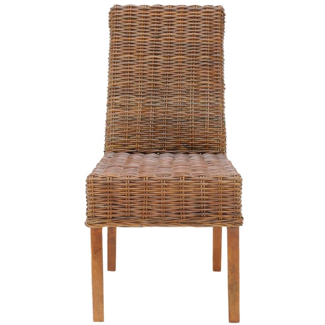 The transitional rattan Side Chair brings a soft touch to contemporary interiors in need of warmth. Crafted with mango...