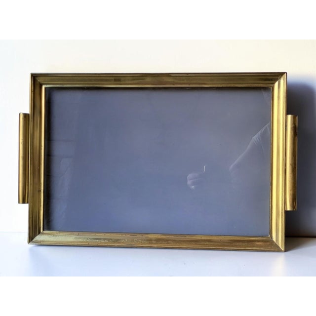 Hollywood Regency brass tray, 1960s / Smoked glass Probably Italian made. The finish is impeccable (welds, screws, etc.)....